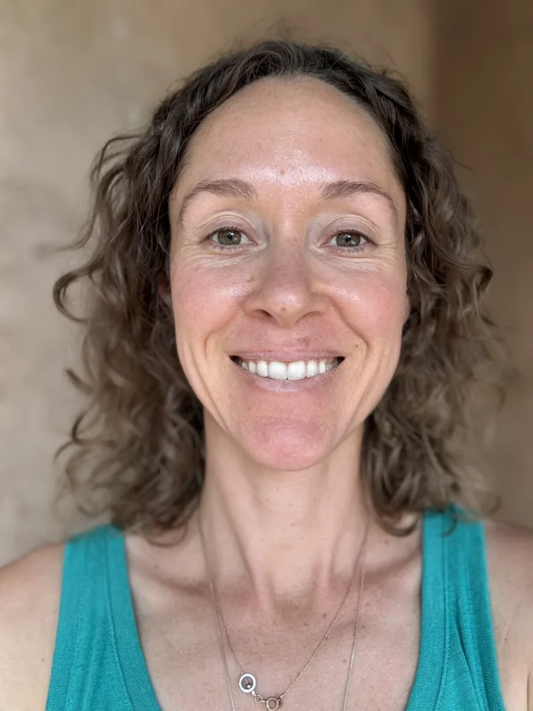 A photo of the author, Maggie Hippman, smiling and facing the camera directly.